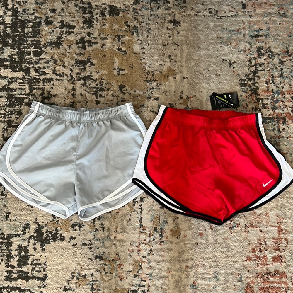 2 pairs of nike running shorts with liner